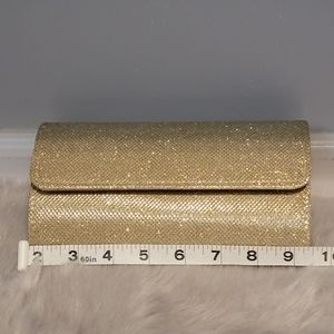 Sparkly gold hand clutch